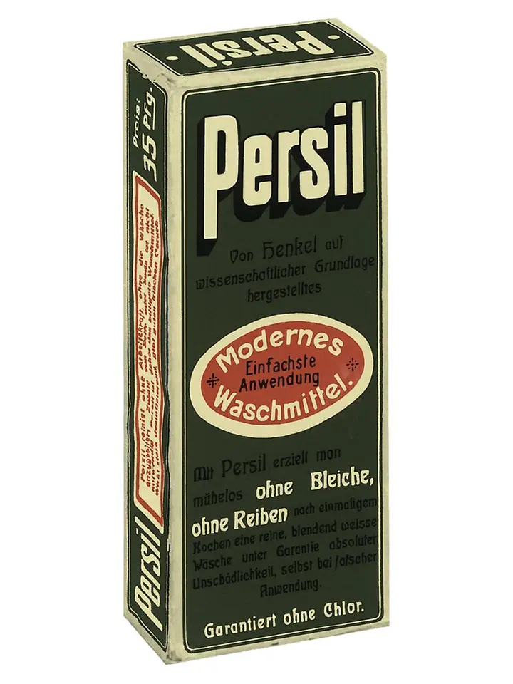 Caja vintage de detergente Persil con texto en alemán y etiqueta ovalada roja que destaca su aplicación moderna y fácil.