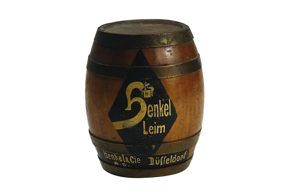 Réplica en miniatura de un tambor de pegamento Henkel impreso de 1925.