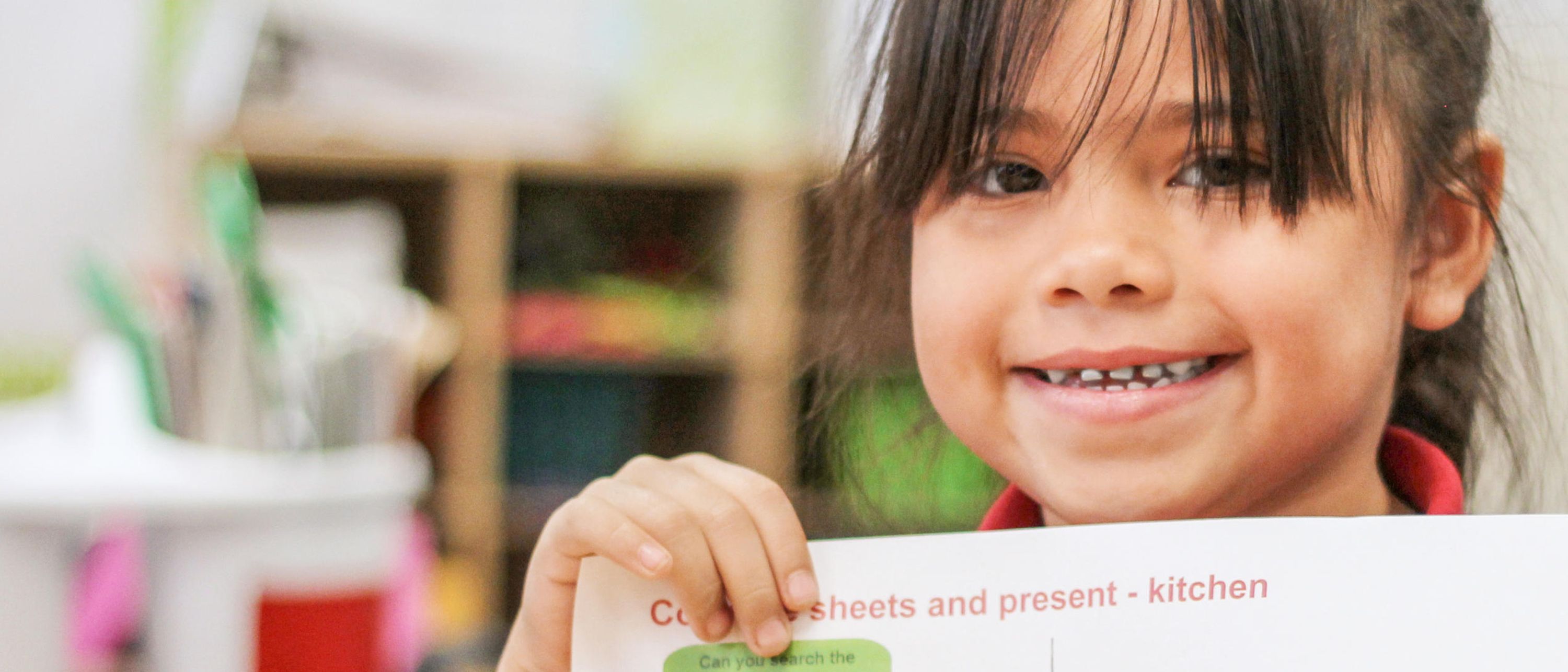 girl holding sustainability teaching materials